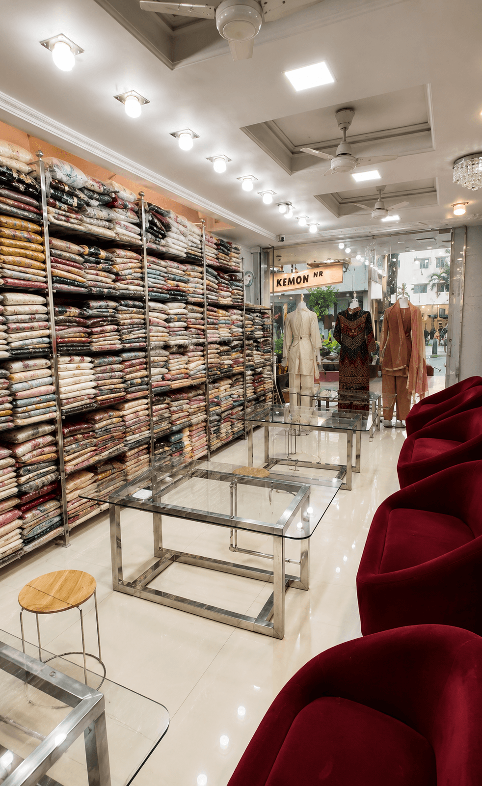 Fabric shelves running the length of the billing counter